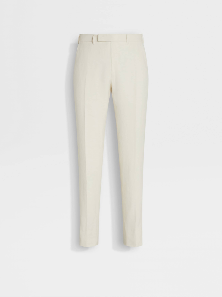 Pantalones de lino azul con flores blancas de Oasi