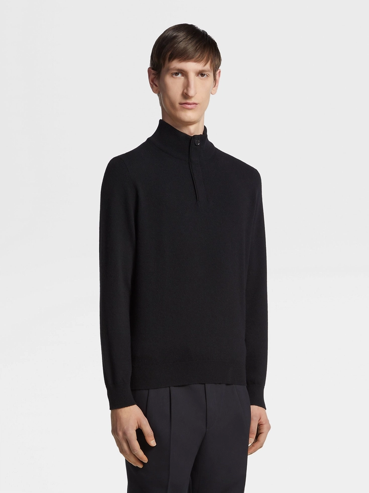 Suéter negro de cachemira con cuello alto y cremallera de Oasi