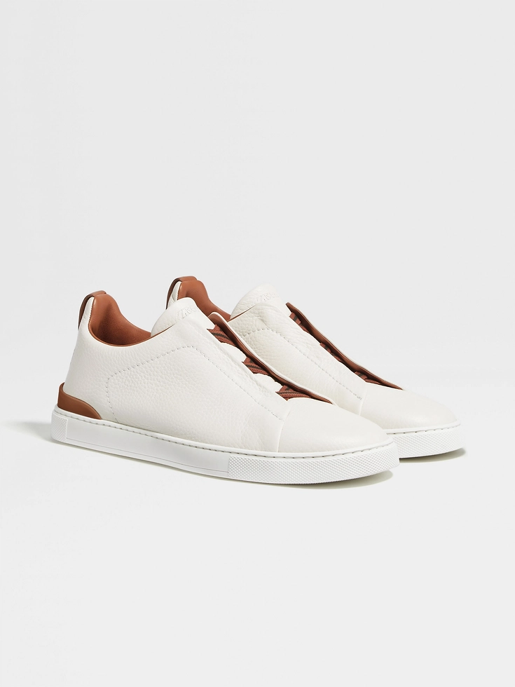 Zapatillas blancas de piel de ciervo con triple puntada™