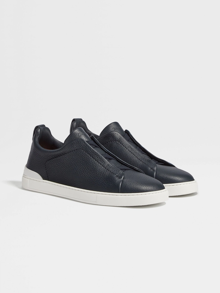 Zapatillas deportivas de piel de ciervo azul marino con triple puntada™
